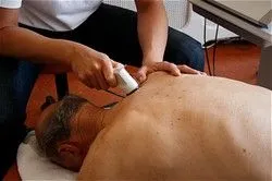 Therapeutic ultrasound applied to a patient's back